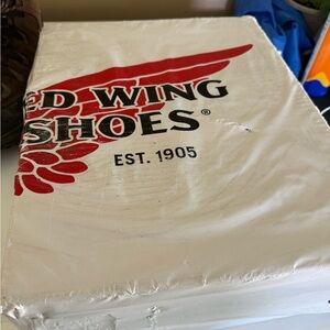 red wings boots believe they are brown.  never been opened.